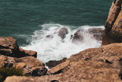 High angle view of rocks in sea