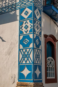 Close-up of the colorful wall decoration of old house at the sunset in paraty, brazil