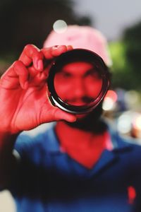 Close-up of hand holding sunglasses