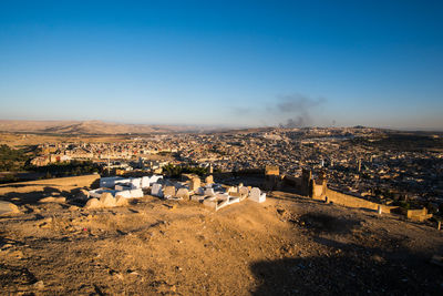 High angle view of townscape against clear blue sky