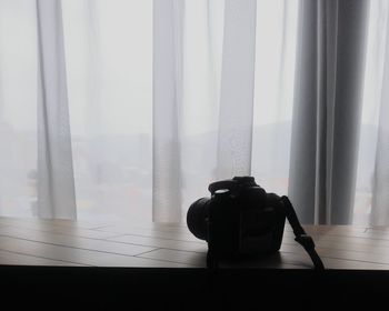 Close-up of camera on table