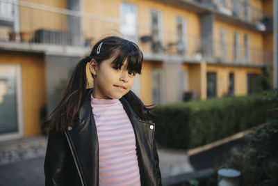 Portrait of smiling girl in leather jacket