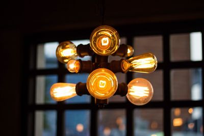 Low angle view of illuminated light bulb