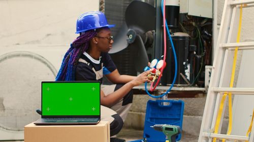 Side view of man working in workshop