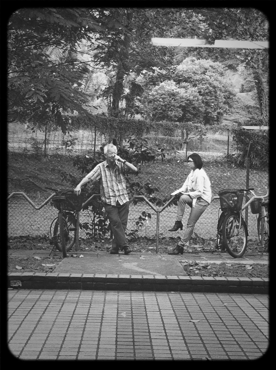 transfer print, full length, lifestyles, leisure activity, childhood, auto post production filter, casual clothing, tree, girls, elementary age, boys, rear view, togetherness, bicycle, men, park - man made space, street