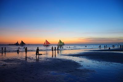 Scenic view of beach at sunset