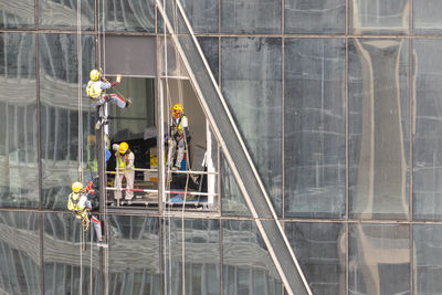 Window washers on building