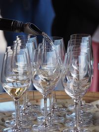 Close-up of wine glasses on table