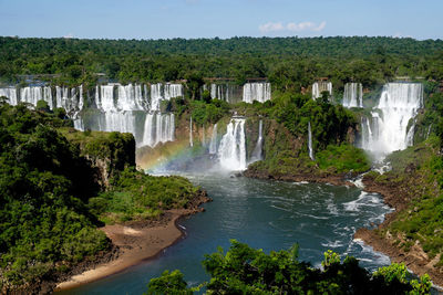 Rainbow at iguazu falls in brazil / argentina