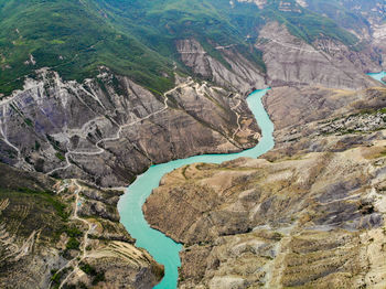 High angle view of river amidst mountains