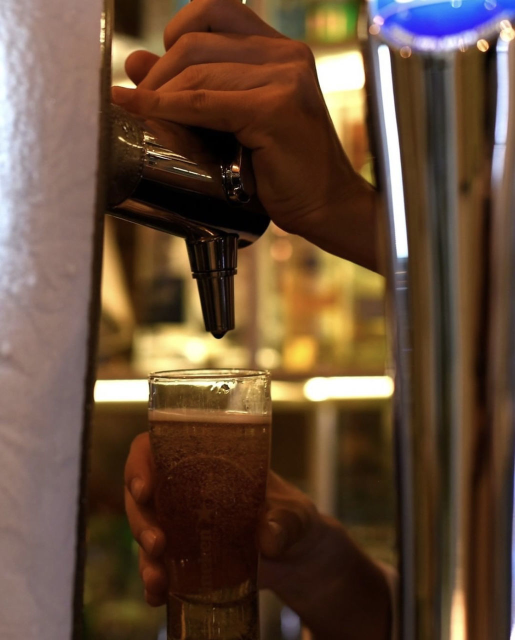 hand, drink, food and drink, refreshment, one person, alcoholic beverage, holding, adult, coffee, indoors, pouring, beer, close-up, business, alcohol, espresso machine, occupation, coffeemaker, working, beer tap, machinery, cafe, bar, making, barista, distilled beverage, focus on foreground