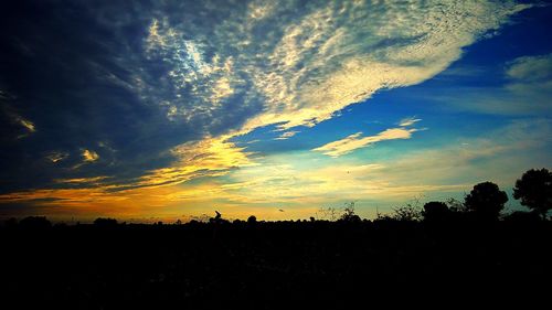 Scenic view of silhouette landscape against sky during sunset