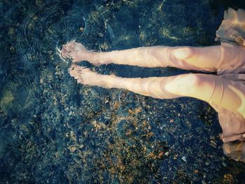 Low section of woman in swimming pool