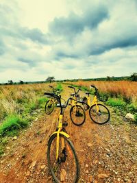 Bicycle on field against sky