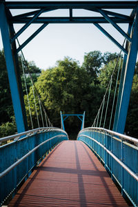 Footbridge against clear sky