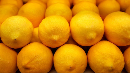 Full frame shot of oranges at market stall