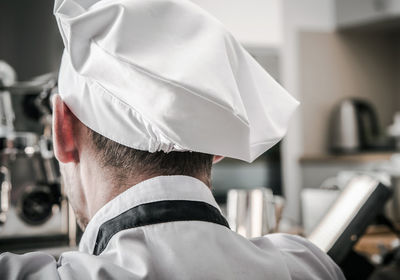 Rear view of woman wearing hat