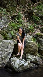 Woman standing on rock formation