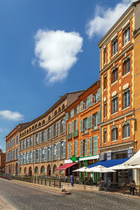 Buildings in city against sky