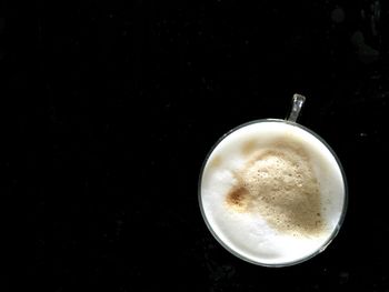 Coffee cup on black background