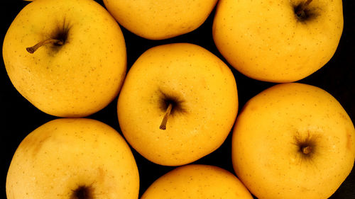 Raw fresh ripe yellow golden delicious apples as delicious vegetarian or vegan food.