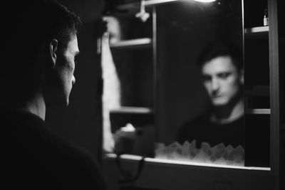 Man reflecting in mirror