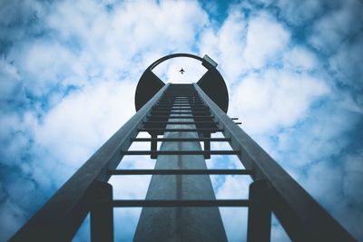 Distant view of airplane seen through lookout tower