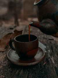 Close-up of coffee cup on table