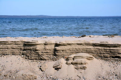 Scenic view of beach against clear sky