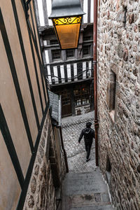 People walking on street amidst buildings