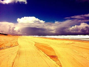 Scenic view of sea against cloudy sky