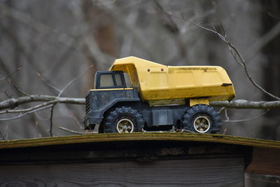 Close-up of yellow toy car on land