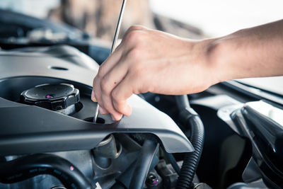 Auto mechanic checking car engine,worker selective focus