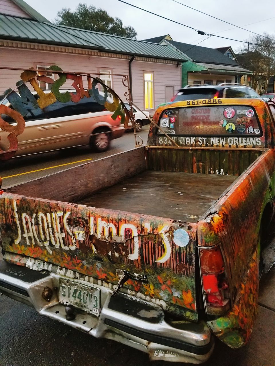 CARS ON STREET BY HOUSES AGAINST BUILDINGS