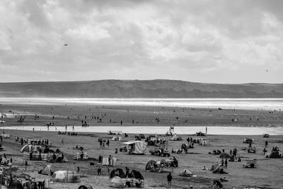 High angle view of people at beach against sky