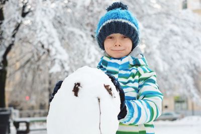 Portrait of cute boy in snow