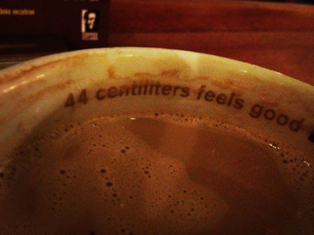 text, indoors, western script, communication, close-up, food and drink, still life, table, selective focus, refreshment, no people, drink, high angle view, freshness, focus on foreground, capital letter, coffee cup, brown, number, circle