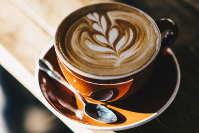 High angle view of cappuccino on table