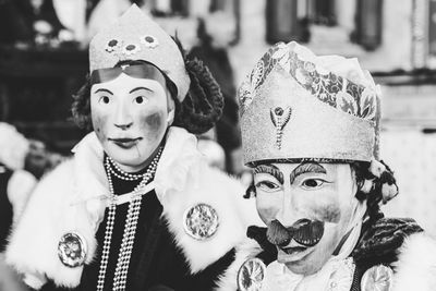 Ancient carnival of sauris. traditional wooden masks. black and white. italy