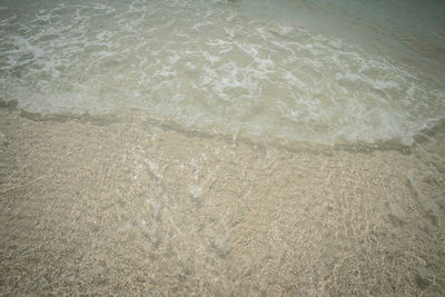 High angle view of surf on beach