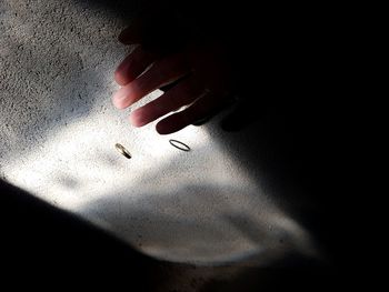 Close-up of hand on wall