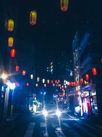 Car on city street at night