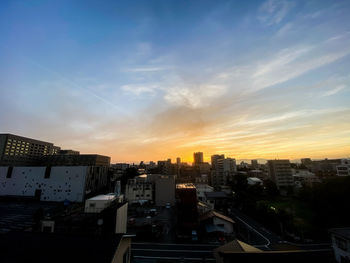 High angle view of buildings against sky during sunset