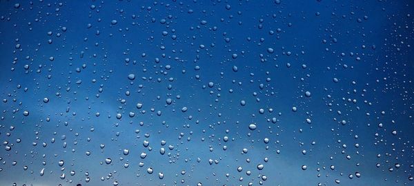 Full frame shot of raindrops on window