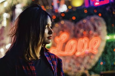 Portrait of young woman looking away