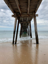 Silhouette of pier on sea against sky