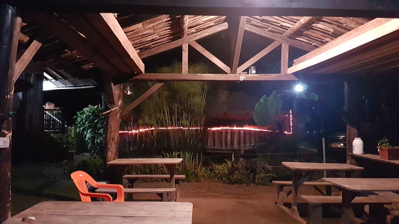 EMPTY CHAIRS AND TABLES AT RESTAURANT