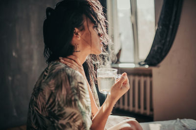 Woman drinking coffee in cup