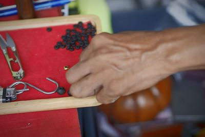 Close-up of man working with hands