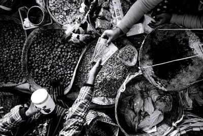 Cropped image of customer giving money to vendor at market